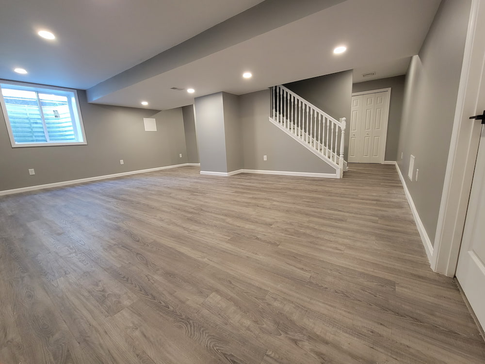 finished basement with grey walls-home addition to add square footage