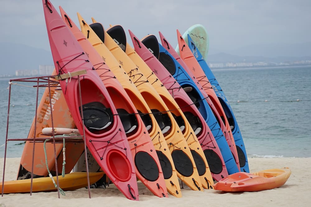 many kayaks standing up