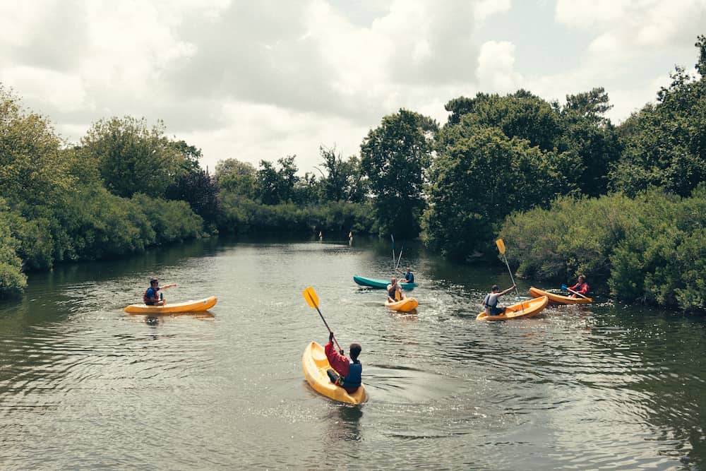 many kayaks on a river