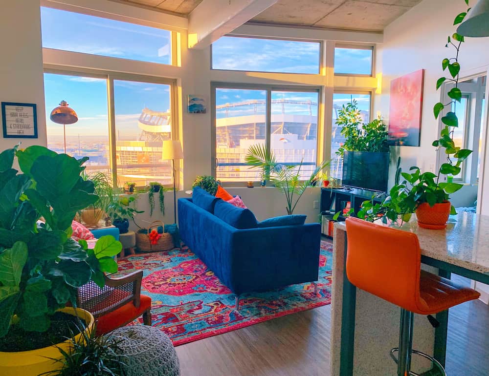 colorful maximalist living room with windows-design trend that needs storage