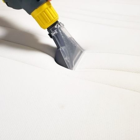 cleaning and vacuuming mattress