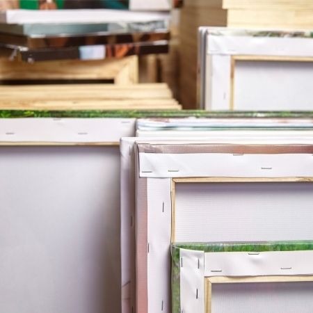 canvas paintings stored vertically in storage