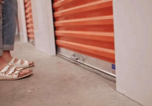 gif of woman opening a storage unit door