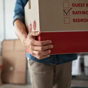 A man carrying a box.