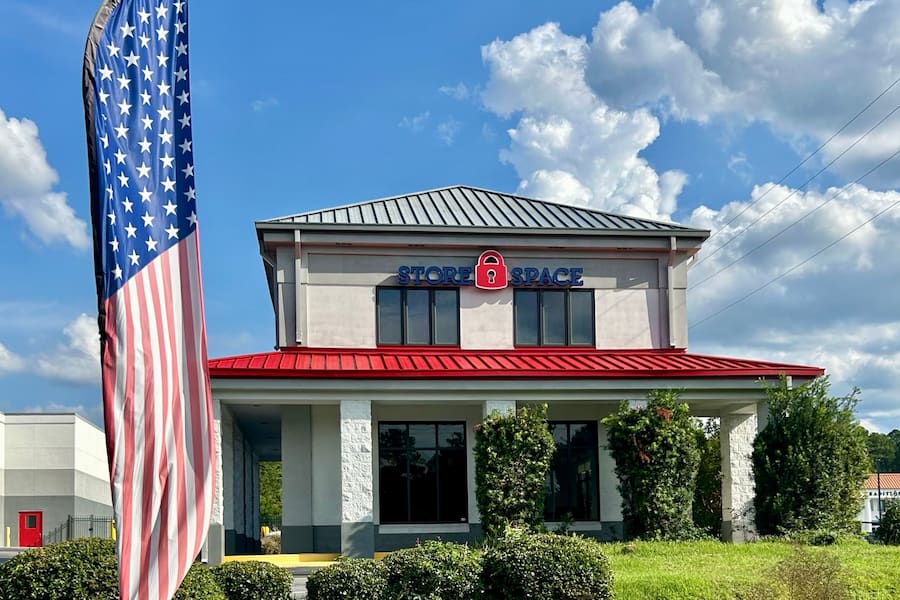store space self storage building with flag at 11440 Blankenbaker Access Dr Louisville, KY 40299