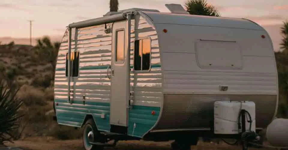 white and blue trailer out of travel trailer storage
