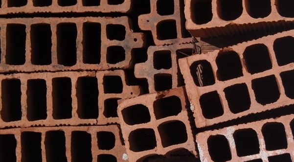 stacked bricks are an example of construction materials storage