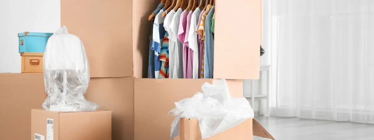 clothes in wardrobe box in storage unit