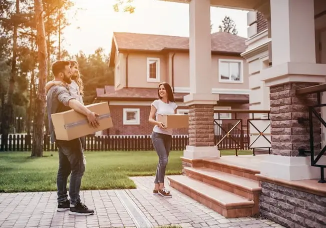 family utilizing moving tips to move into their new house
