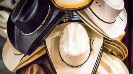 cowboy hats on a rack