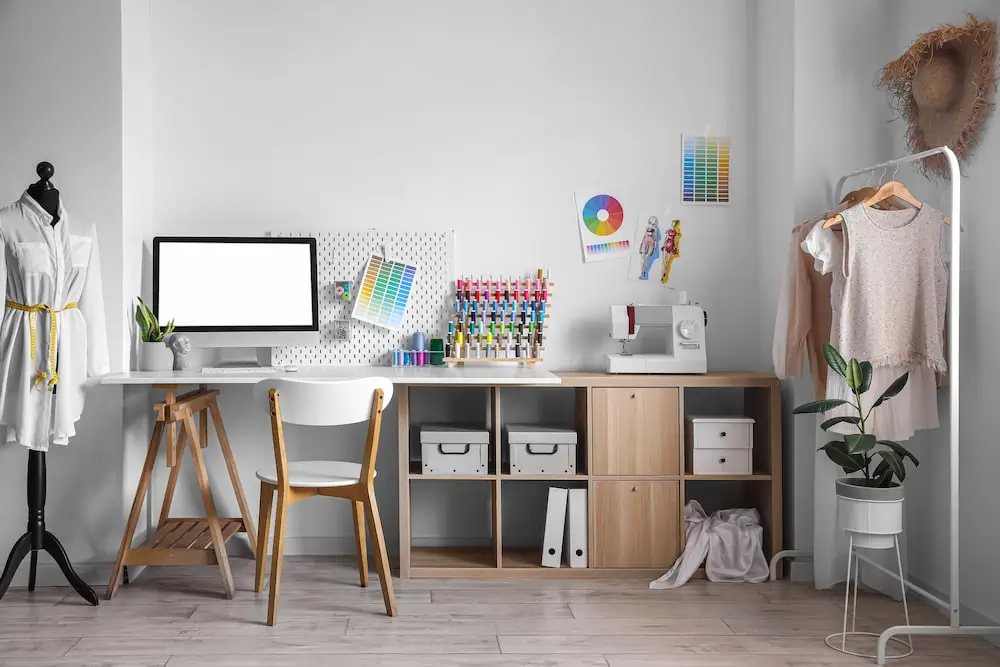 craft room with a desk and sewing supplies