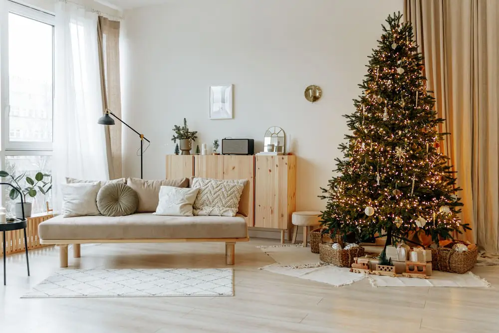 minimalistic living room with a tree decorated for Christmas