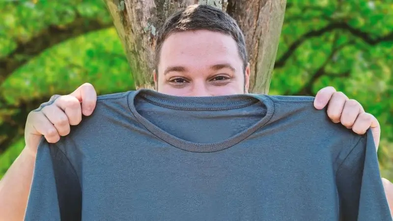 holding up shirt to see if it sparks joy