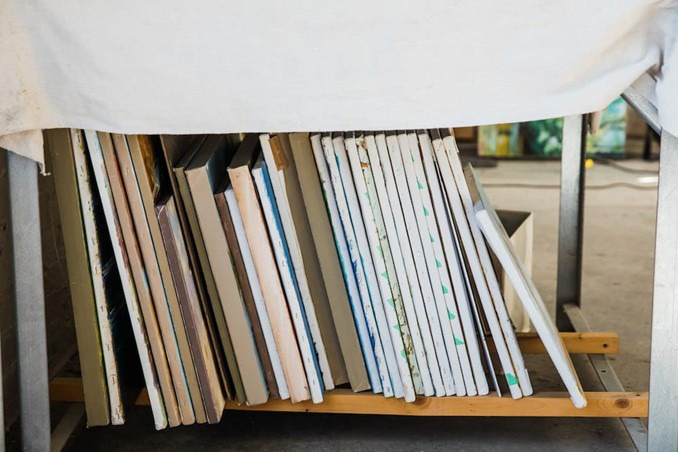 canvas paintings stored together