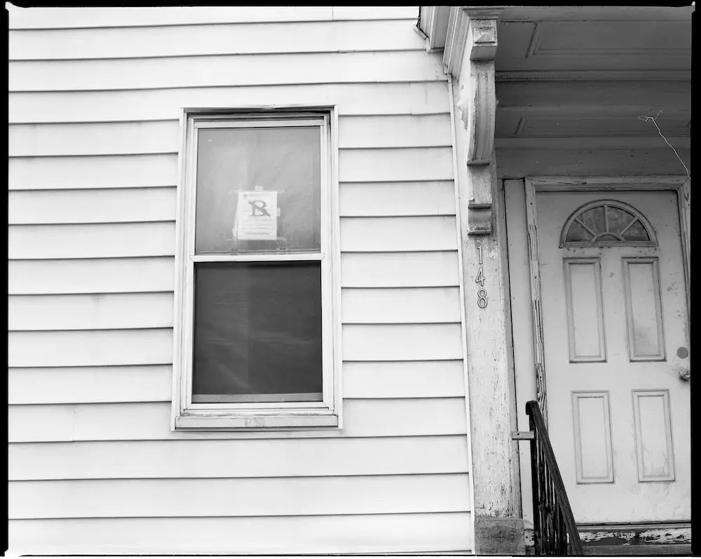a house with an eviction notice in the window