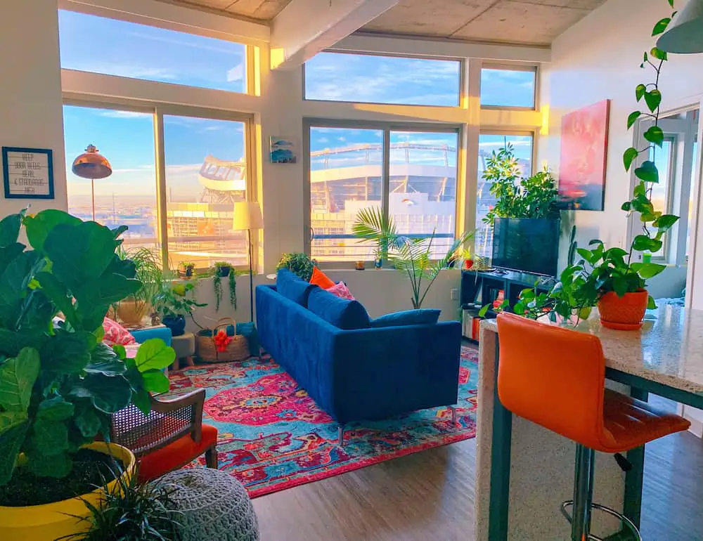 colorful maximalist living room with windows-design trend that needs storage