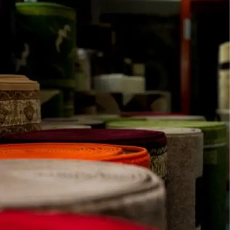 vertically stacked rugs in storage