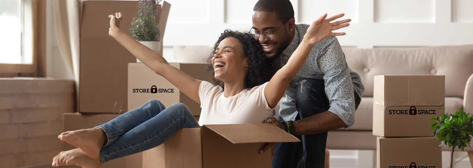 woman in box pushed by a man